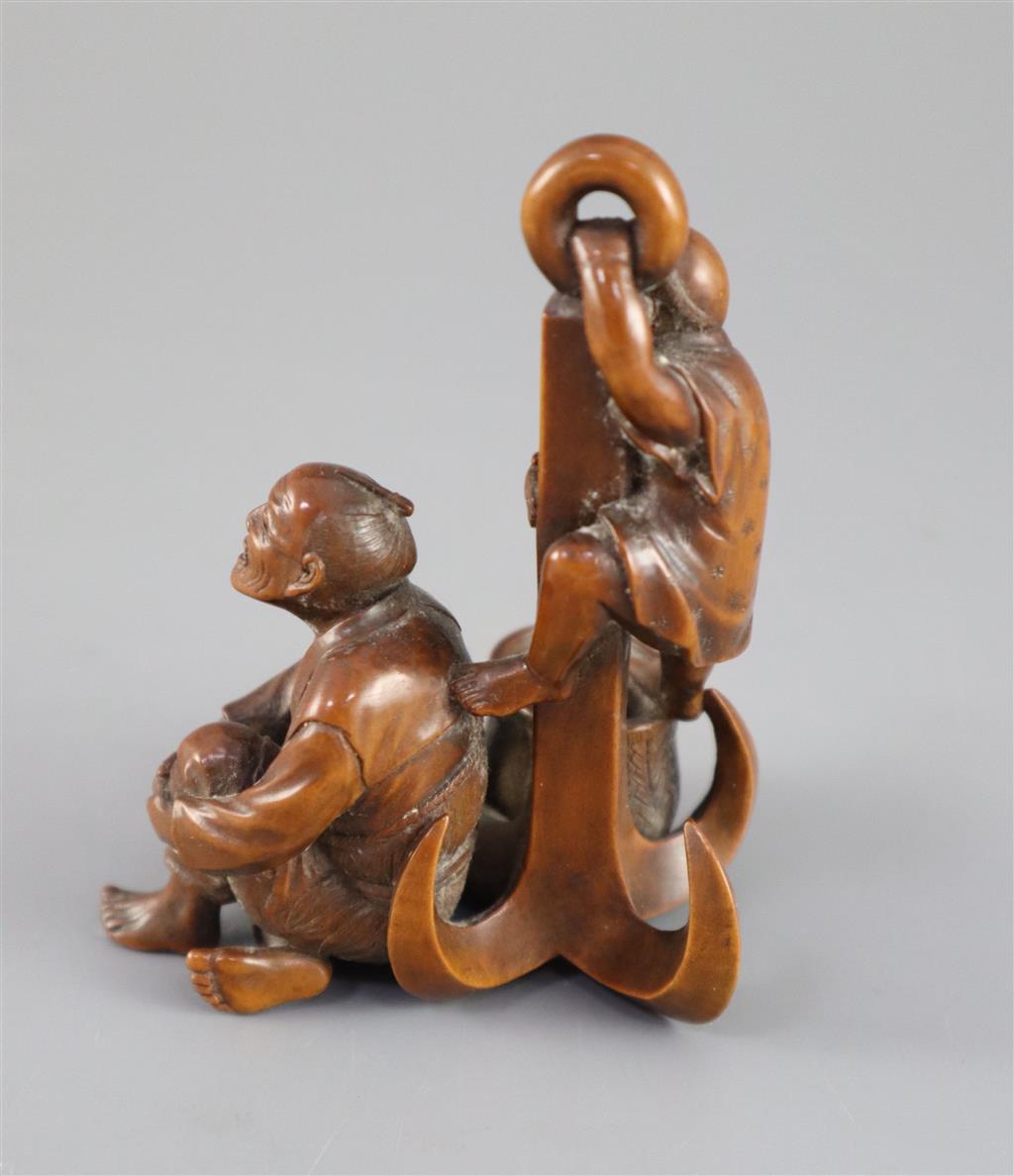 A Japanese boxwood okimono of two sailors and an anchor, Meiji period, 9.5cm high